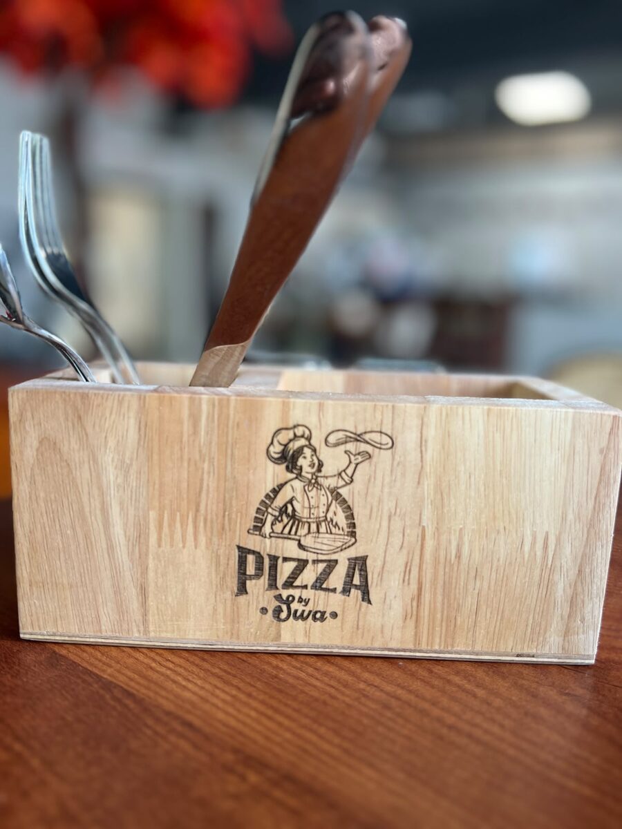 The Pizza by Swa chef mascot, engraved on our table caddy